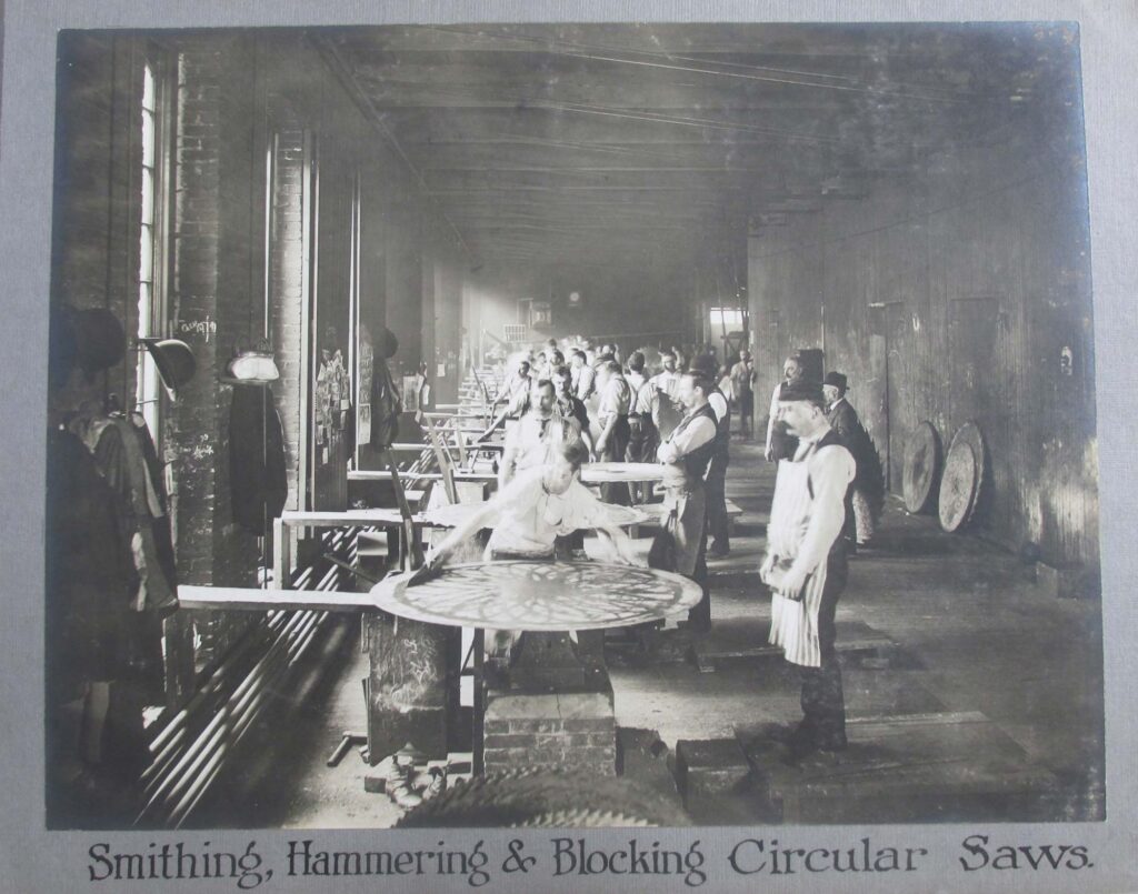 Working on circular saw blades at Disston Saw Works. Disston Factory Photo Album, Historical Society of Tacony.